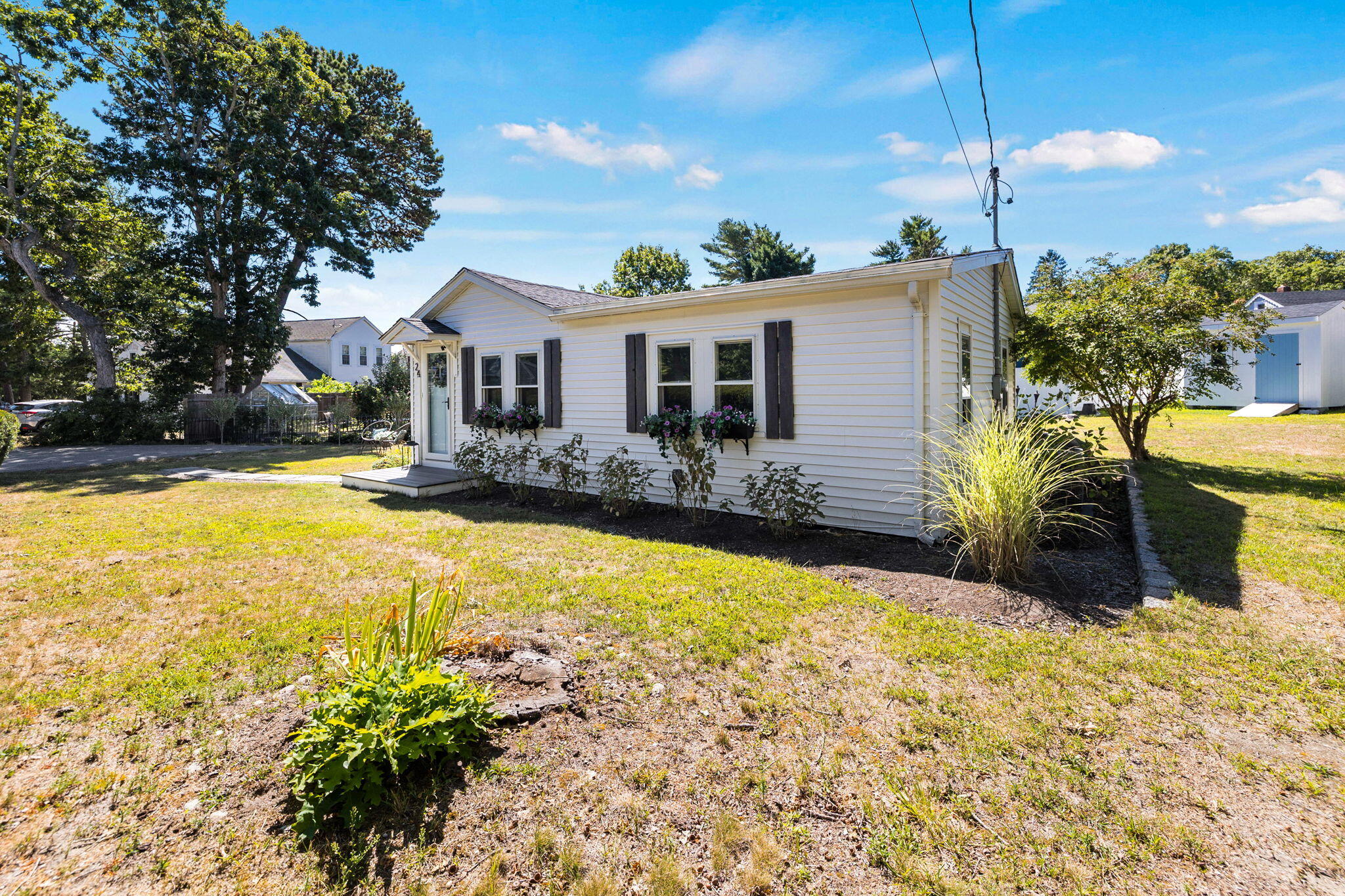 24 Butler Street Buzzards Bay, MA 02532 - Photo 29 of 37 a view of a house with pool plants and large trees