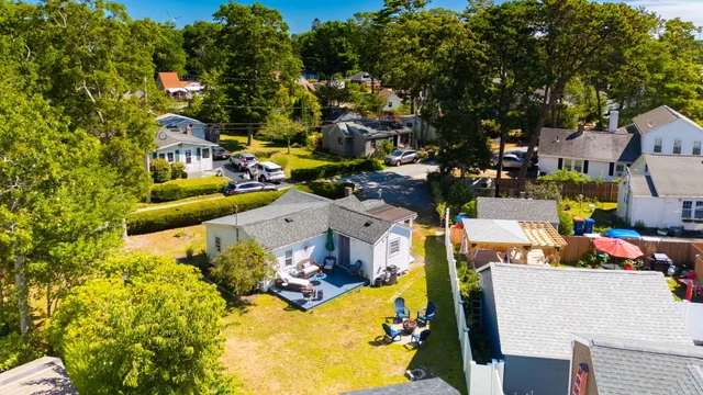 an aerial view of a houses with swimming pool
