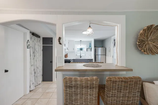 a view of kitchen with granite countertop cabinets