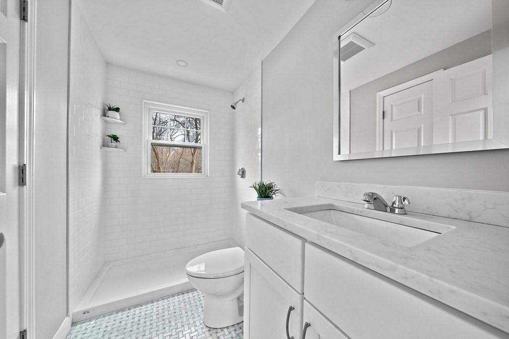 14 Curtis Road Canton, MA 02021 - Photo 14 of 23 a bathroom with a sink a toilet and shower