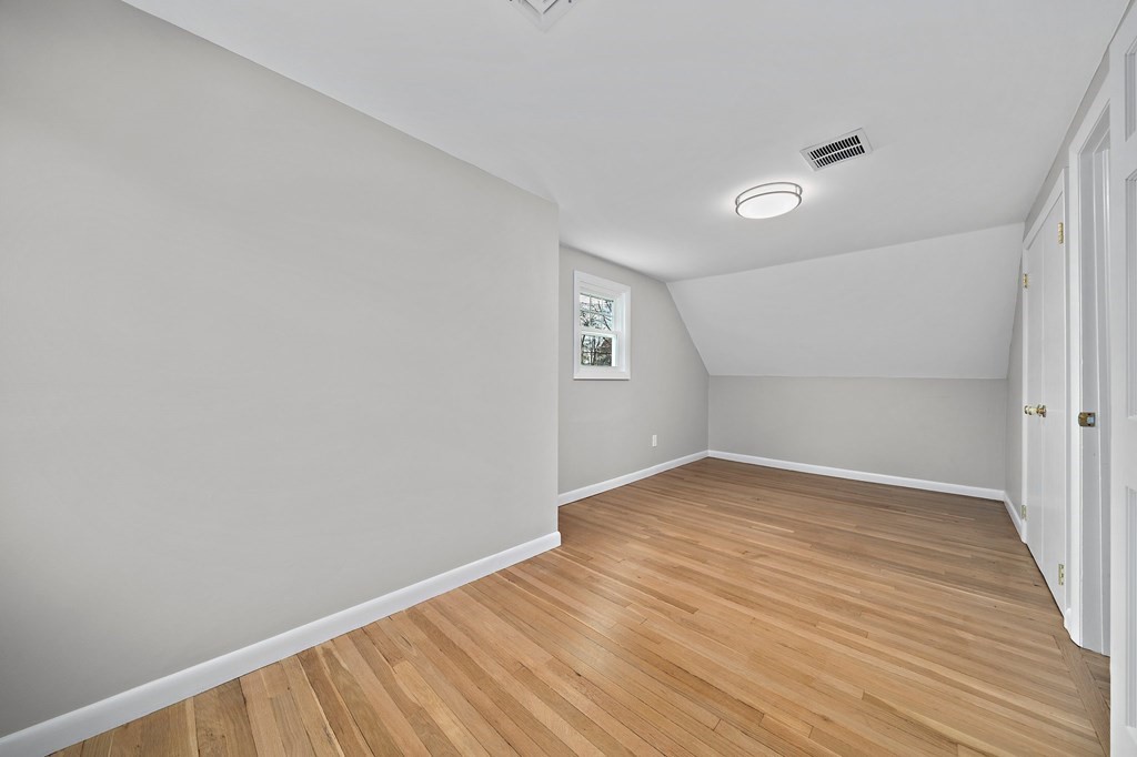 14 Curtis Road Canton, MA 02021 - Photo 17 of 23 a view of an empty room with wooden floor and a window