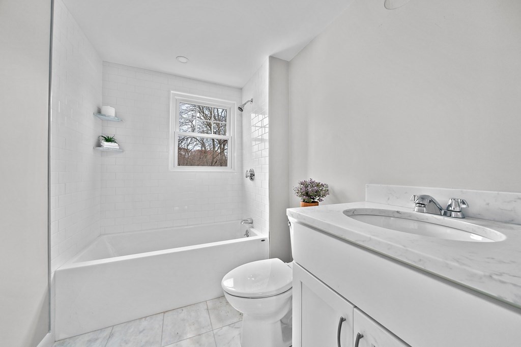 14 Curtis Road Canton, MA 02021 - Photo 18 of 23 a bathroom with a sink toilet and shower