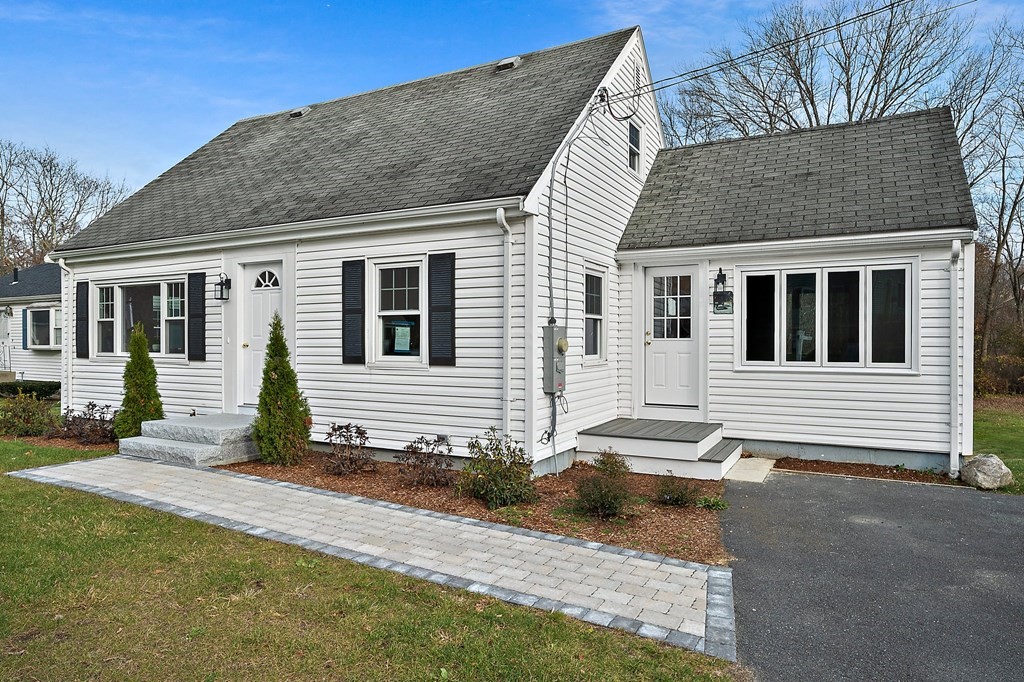 14 Curtis Road Canton, MA 02021 - Photo 2 of 23 a front view of a house with a yard