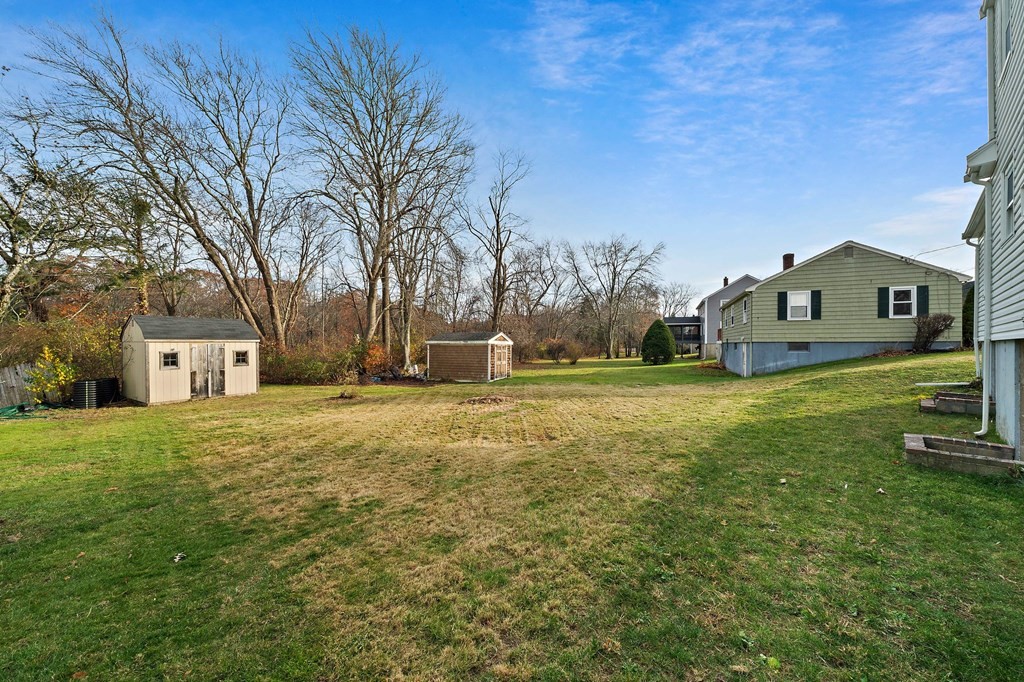 14 Curtis Road Canton, MA 02021 - Photo 21 of 23 a front view of house with yard and trees in the background