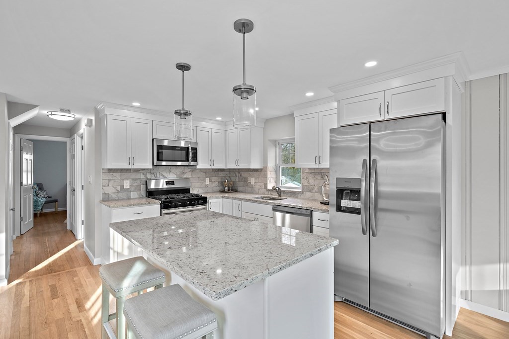 14 Curtis Road Canton, MA 02021 - Photo 4 of 23 a kitchen with stainless steel appliances granite countertop a sink refrigerator and cabinets
