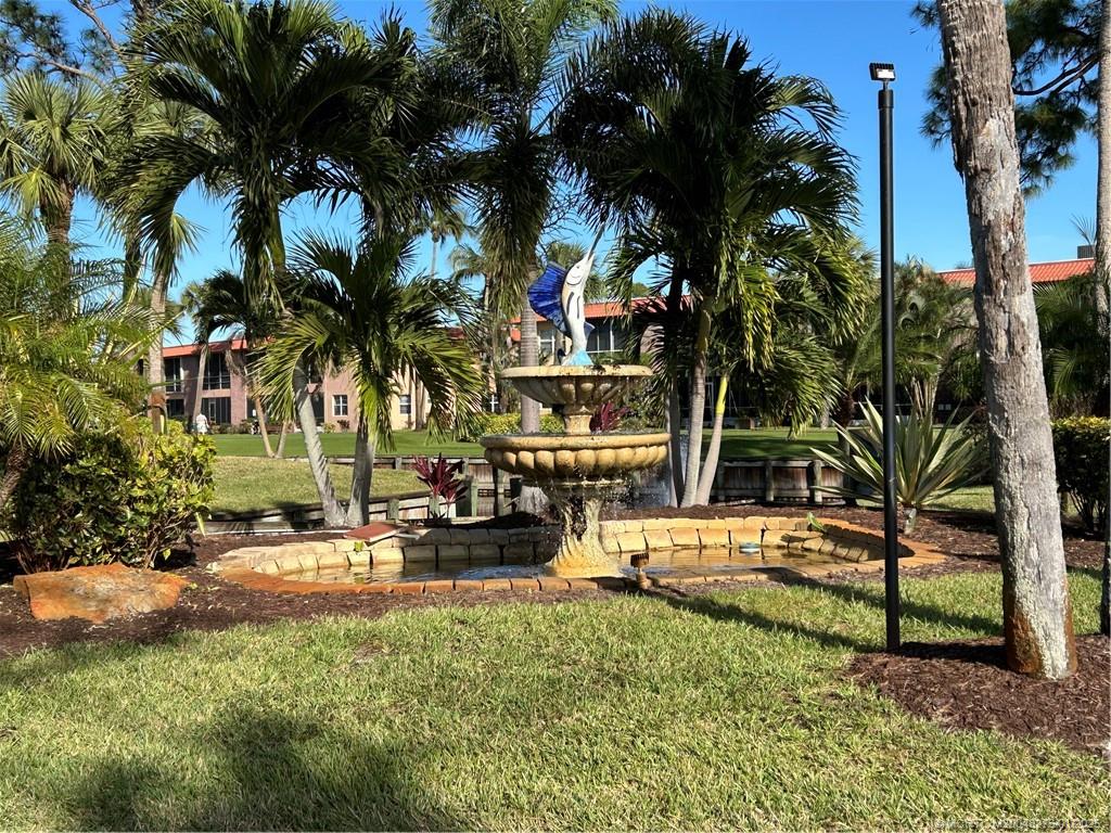 1997 Southwest Palm City Road, Unit 48H Stuart, FL 34994 - Photo 25 of 49 Main entrance with Sailfish statue
