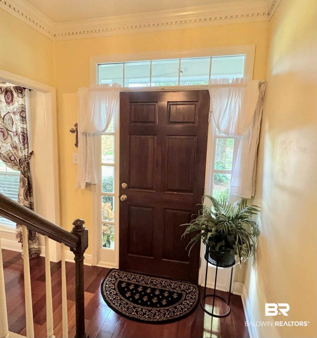 31163 Woodland Way Daphne, AL 36527 - Photo 6 of 44 Entrance foyer featuring hardwood / wood-style floors and crown molding
