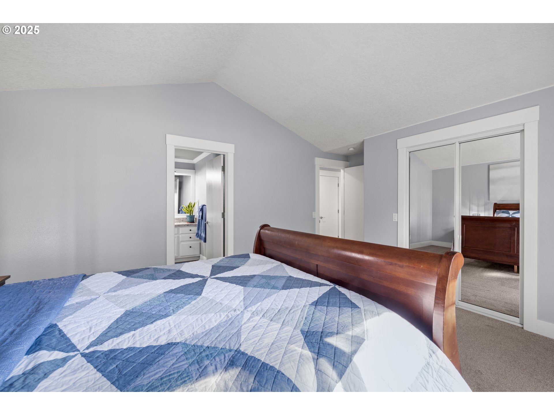 7243 Southwest Applegate Drive Beaverton, OR 97007 - Photo 14 of 39 a bedroom with a bed and a large mirror