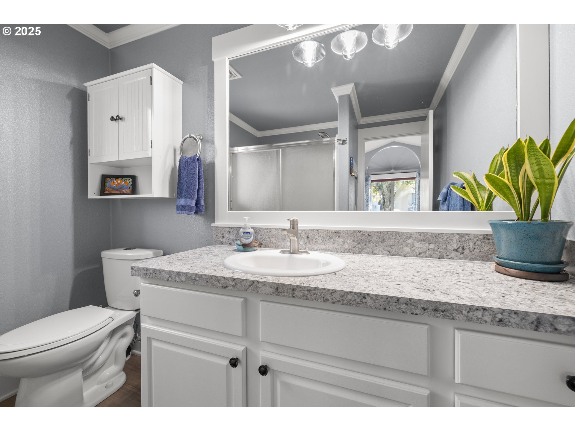 7243 Southwest Applegate Drive Beaverton, OR 97007 - Photo 18 of 39 a bathroom with a granite countertop toilet sink and mirror