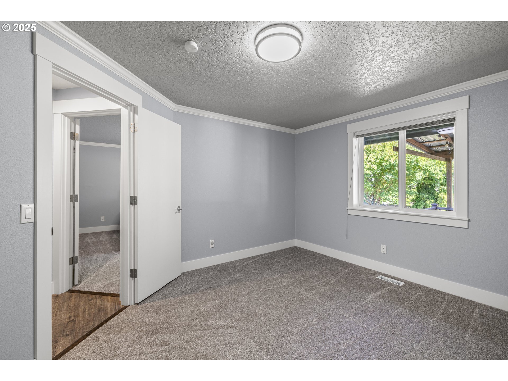 7243 Southwest Applegate Drive Beaverton, OR 97007 - Photo 21 of 39 a view of an empty room with a window