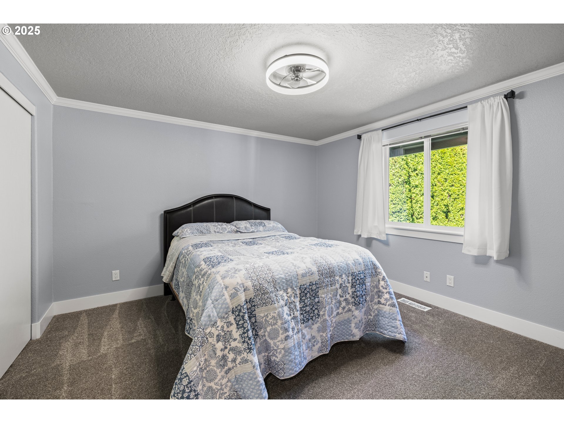 7243 Southwest Applegate Drive Beaverton, OR 97007 - Photo 23 of 39 a bedroom with a bed and a window