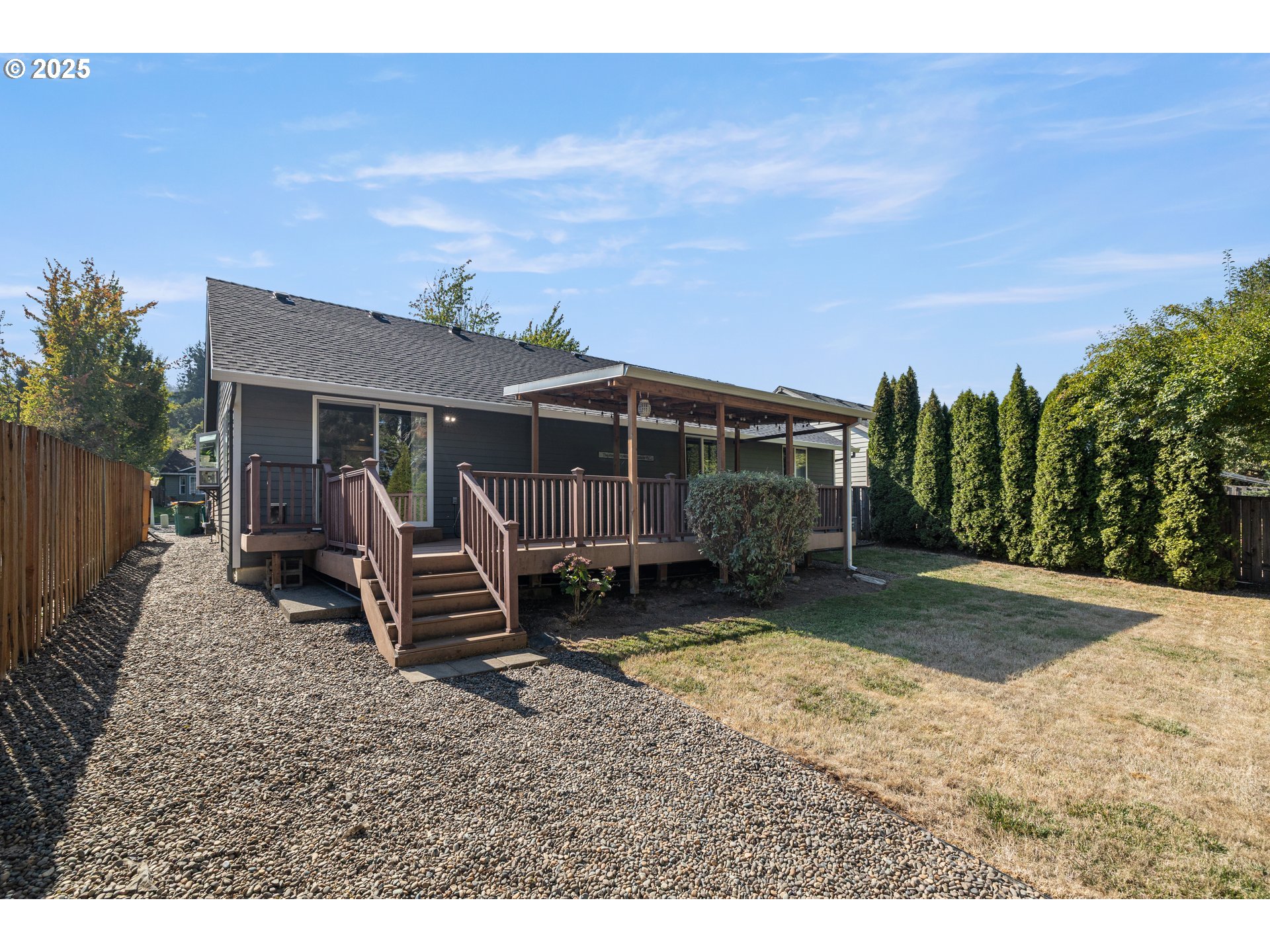 7243 Southwest Applegate Drive Beaverton, OR 97007 - Photo 29 of 39 a view of a house with backyard porch and sitting area