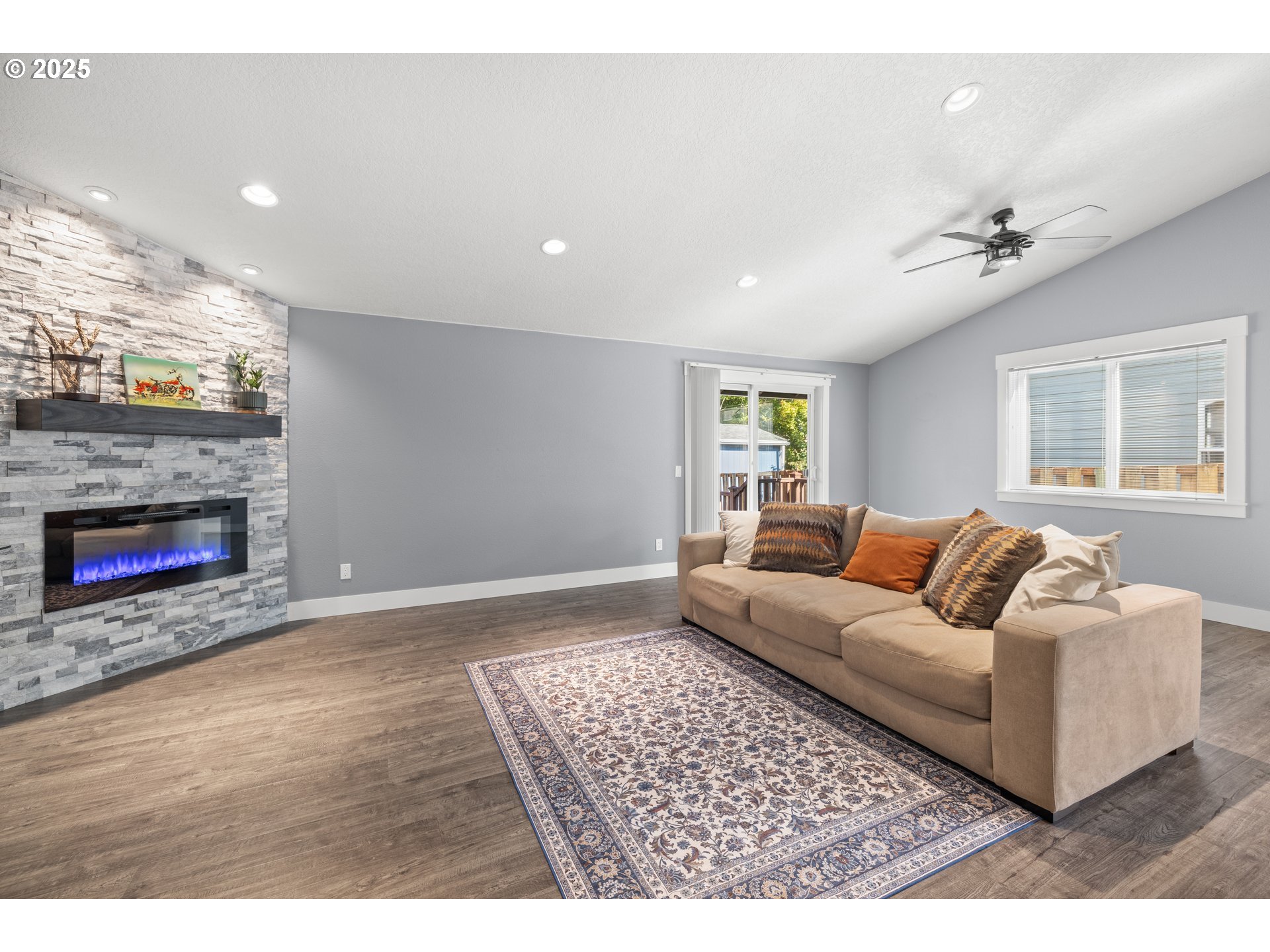 7243 Southwest Applegate Drive Beaverton, OR 97007 - Photo 4 of 39 a living room with furniture and a fireplace