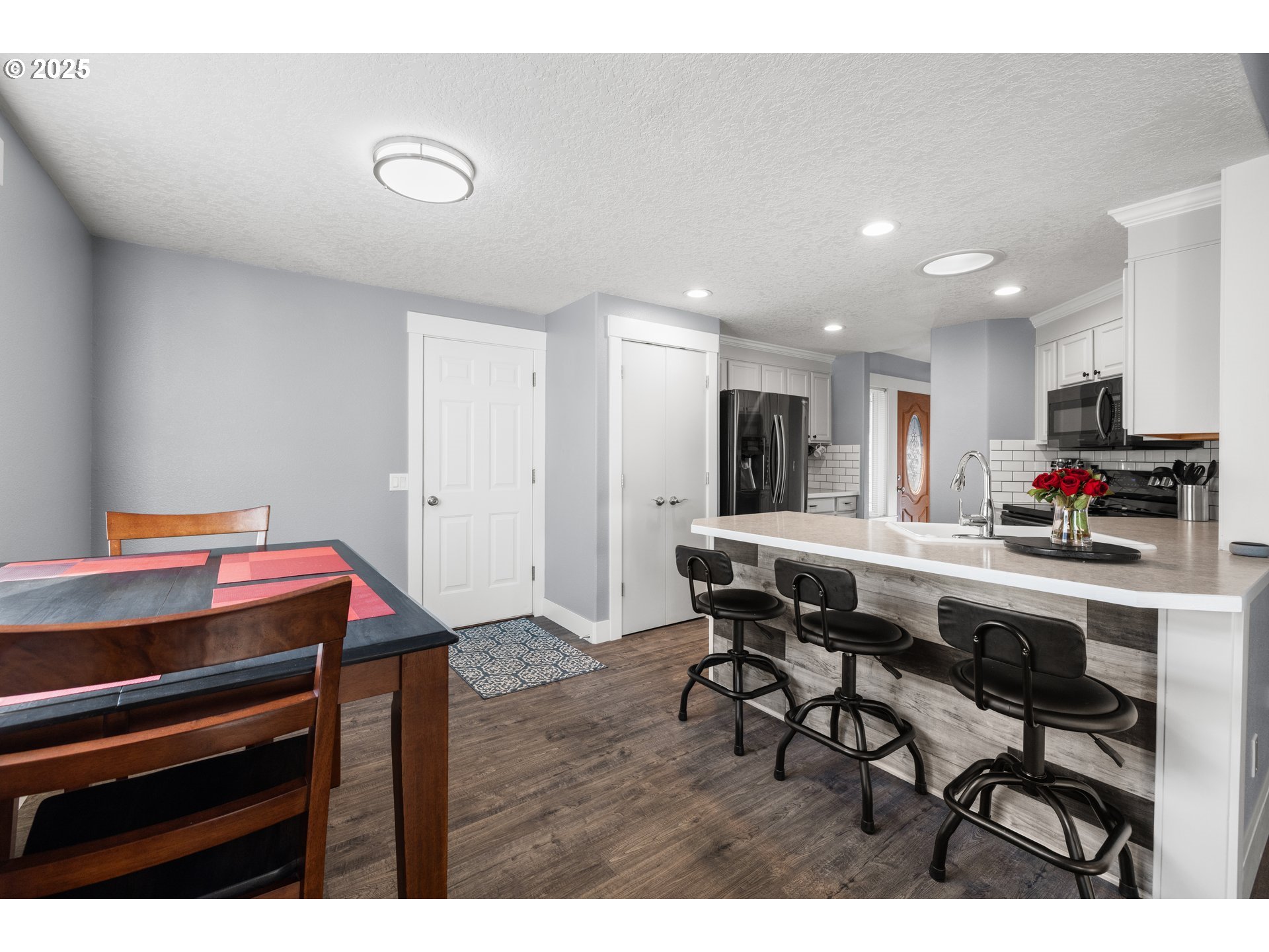 7243 Southwest Applegate Drive Beaverton, OR 97007 - Photo 9 of 39 a kitchen with a table and chairs in it