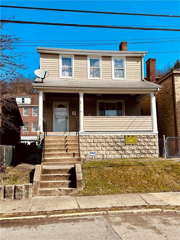 544 Woodward Avenue McKees Rocks, PA 15136 - Photo 1 of 13 a front view of a house with a parking area