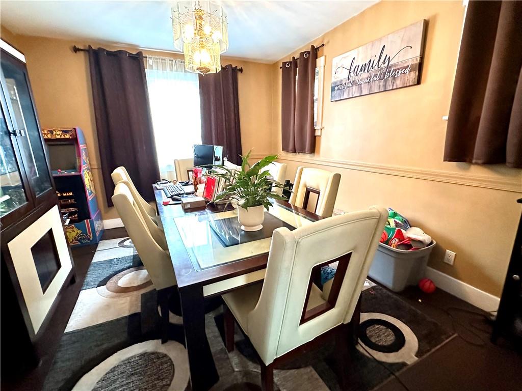 544 Woodward Avenue McKees Rocks, PA 15136 - Photo 4 of 13 a dining room with furniture and a window