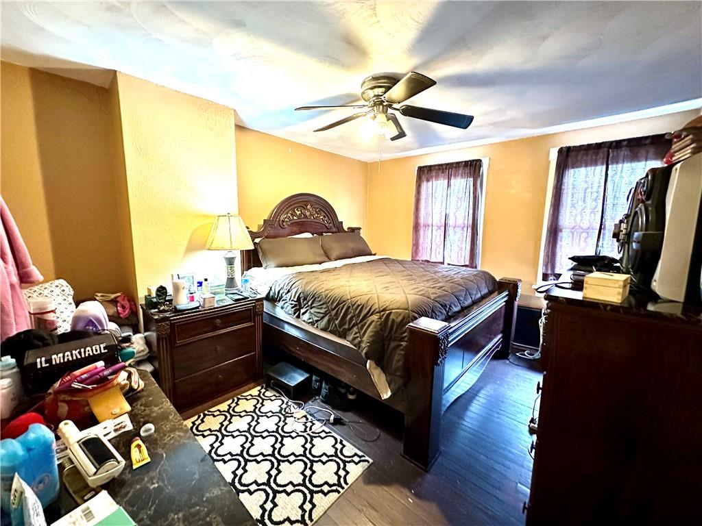 544 Woodward Avenue McKees Rocks, PA 15136 - Photo 9 of 13 a bedroom with a bed and wooden floor
