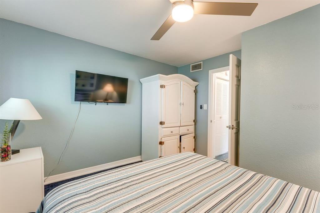 900 North Harbor Terrace Road Tavares, FL 32778 - Photo 19 of 58 a bedroom with a bed and a flat screen tv