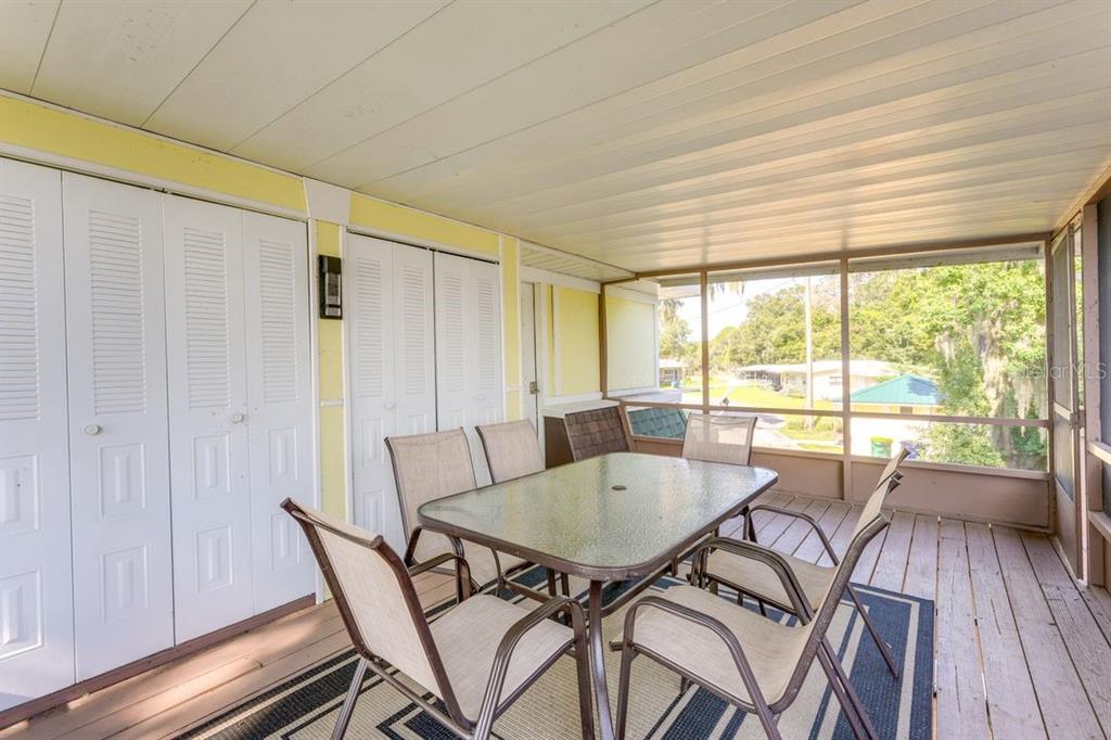 900 North Harbor Terrace Road Tavares, FL 32778 - Photo 24 of 58 a dining room with furniture and wooden floor