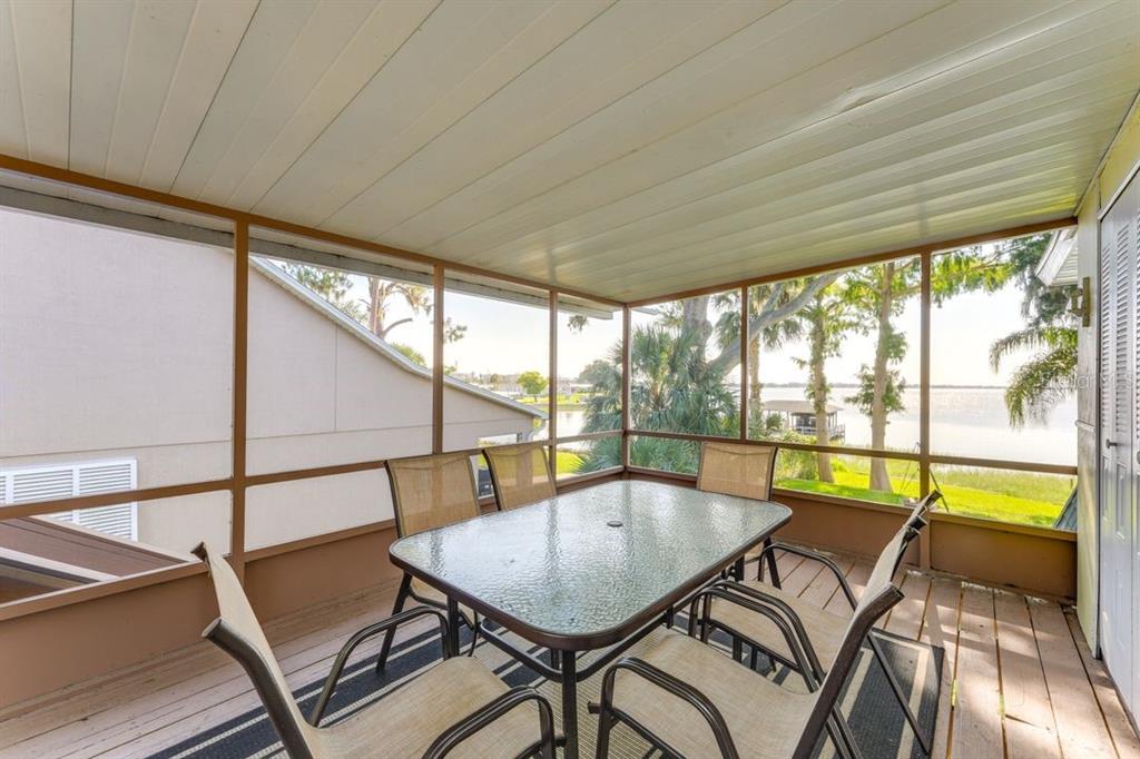 900 North Harbor Terrace Road Tavares, FL 32778 - Photo 25 of 58 a view of a dining room with furniture window and outside view