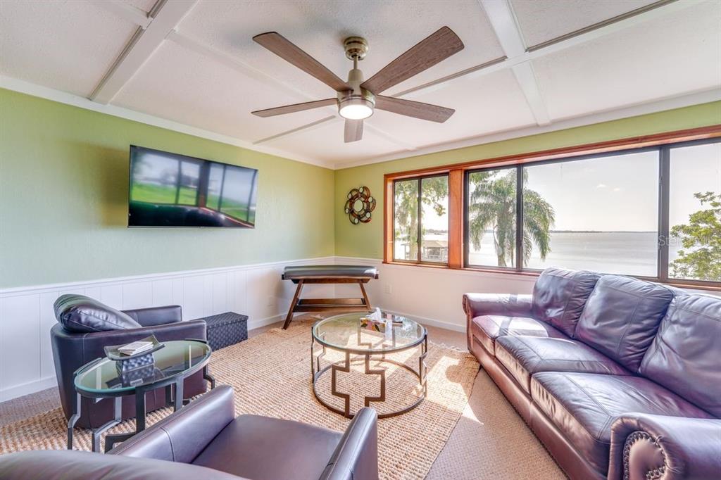 900 North Harbor Terrace Road Tavares, FL 32778 - Photo 28 of 58 a living room with furniture and a large window