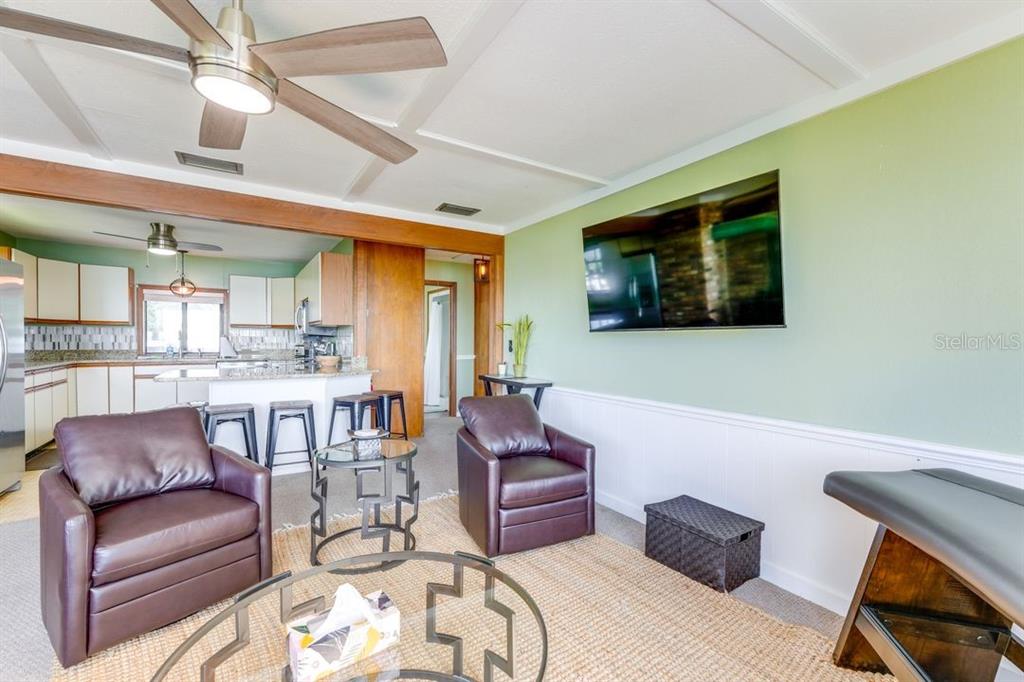 900 North Harbor Terrace Road Tavares, FL 32778 - Photo 29 of 58 a living room with furniture and a flat screen tv