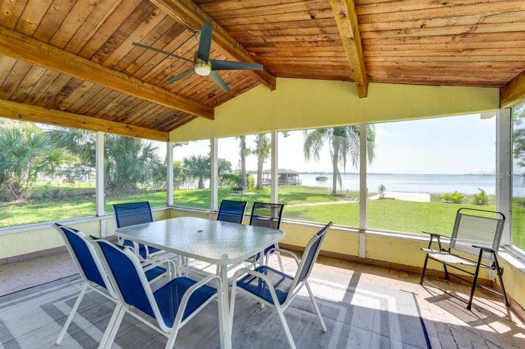 900 North Harbor Terrace Road Tavares, FL 32778 - Photo 3 of 58 a view of an outdoor dining space with furniture and garden view