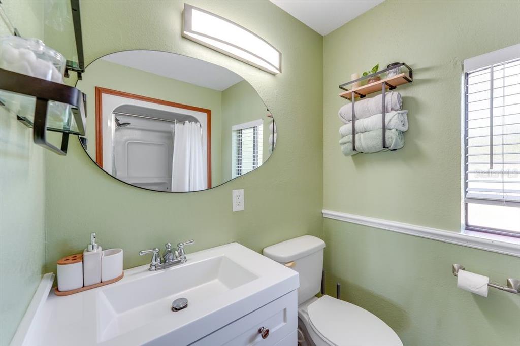 900 North Harbor Terrace Road Tavares, FL 32778 - Photo 38 of 58 a bathroom with a toilet sink and mirror