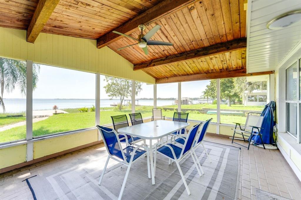 900 North Harbor Terrace Road Tavares, FL 32778 - Photo 4 of 58 a dining room with furniture and outdoor view