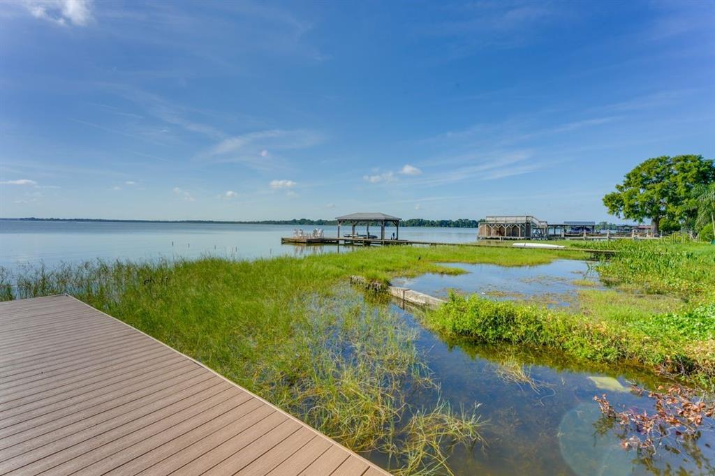 900 North Harbor Terrace Road Tavares, FL 32778 - Photo 45 of 58 a view of a lake with a big yard