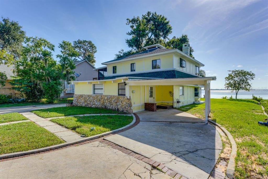 900 North Harbor Terrace Road Tavares, FL 32778 - Photo 48 of 58 a front view of a house with garden