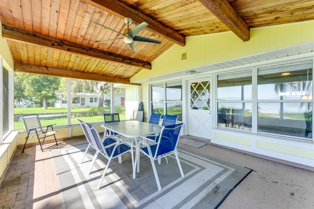 900 North Harbor Terrace Road Tavares, FL 32778 - Photo 5 of 58 a dining room with furniture and wooden floor