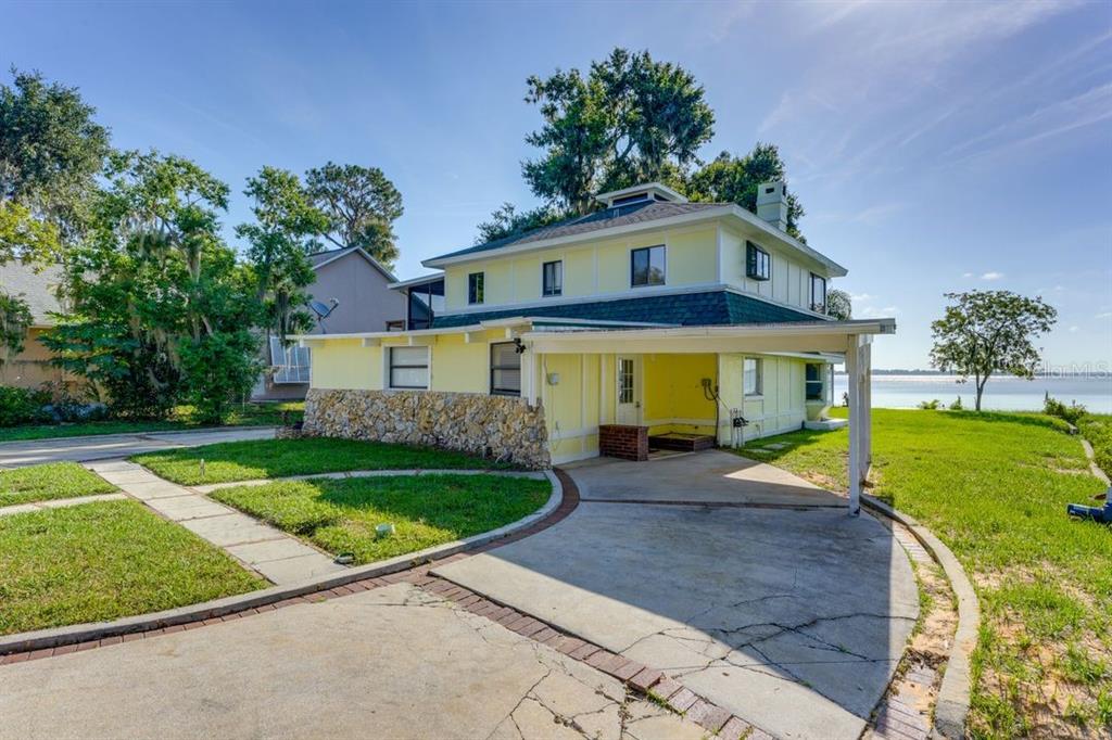 900 North Harbor Terrace Road Tavares, FL 32778 - Photo 52 of 58 a front view of a house with garden