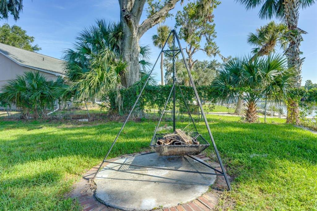 900 North Harbor Terrace Road Tavares, FL 32778 - Photo 53 of 58 a view of a backyard with a fountain