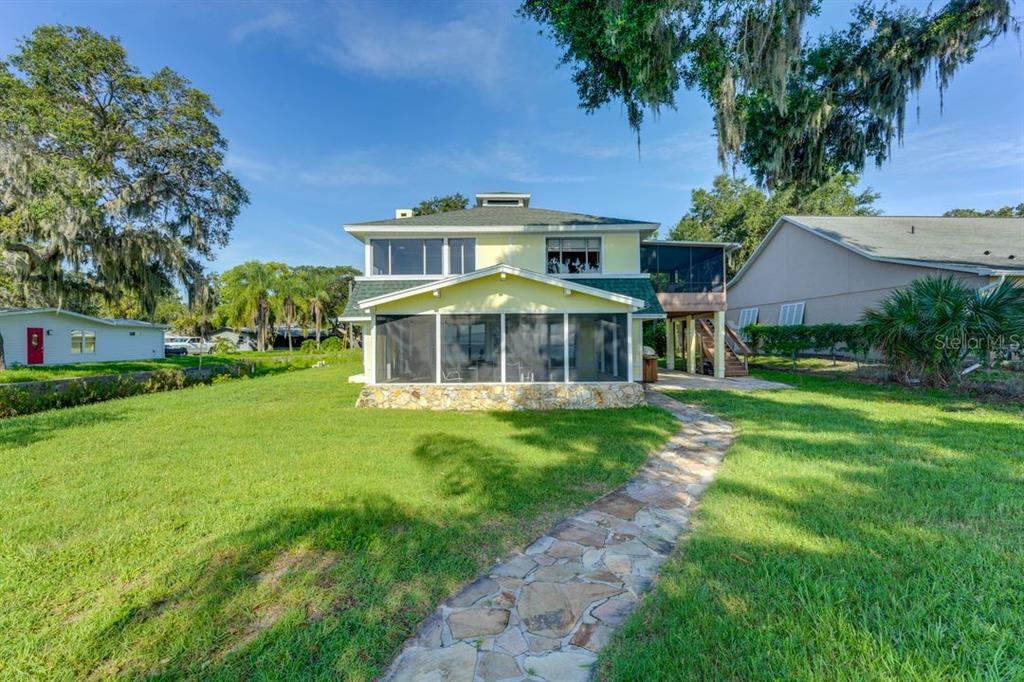 900 North Harbor Terrace Road Tavares, FL 32778 - Photo 58 of 58 a front view of a house with a yard