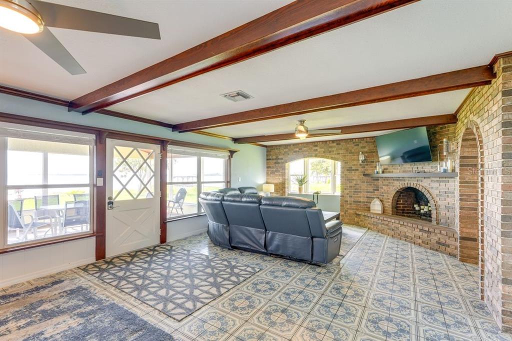 900 North Harbor Terrace Road Tavares, FL 32778 - Photo 10 of 58 a living room with furniture and a fireplace