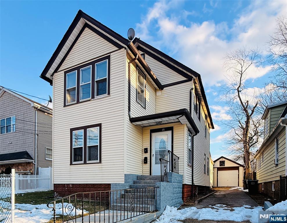 a front view of a house with garage