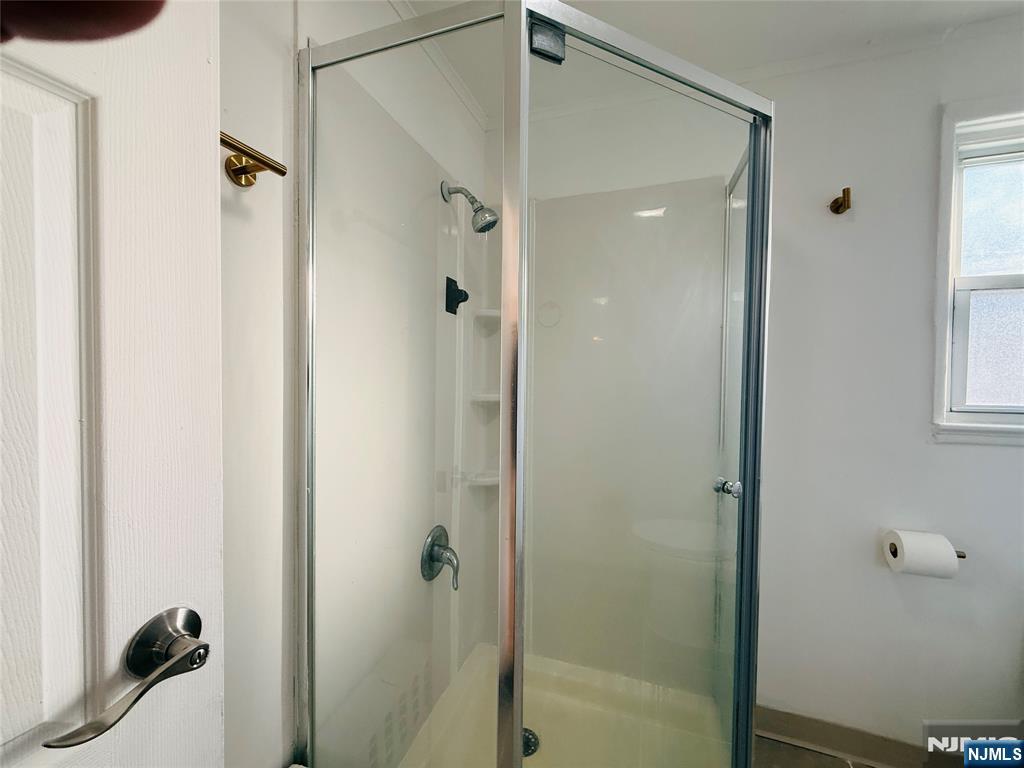 86 West Main Street, Unit 2 Bergenfield, NJ 07621 - Photo 11 of 12 a bathroom with a shower and a sink