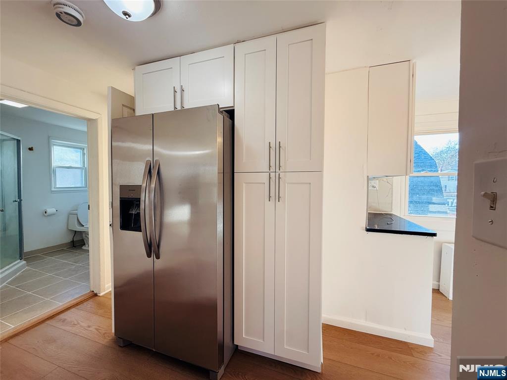 86 West Main Street, Unit 2 Bergenfield, NJ 07621 - Photo 8 of 12 a metallic refrigerator freezer sitting in a kitchen