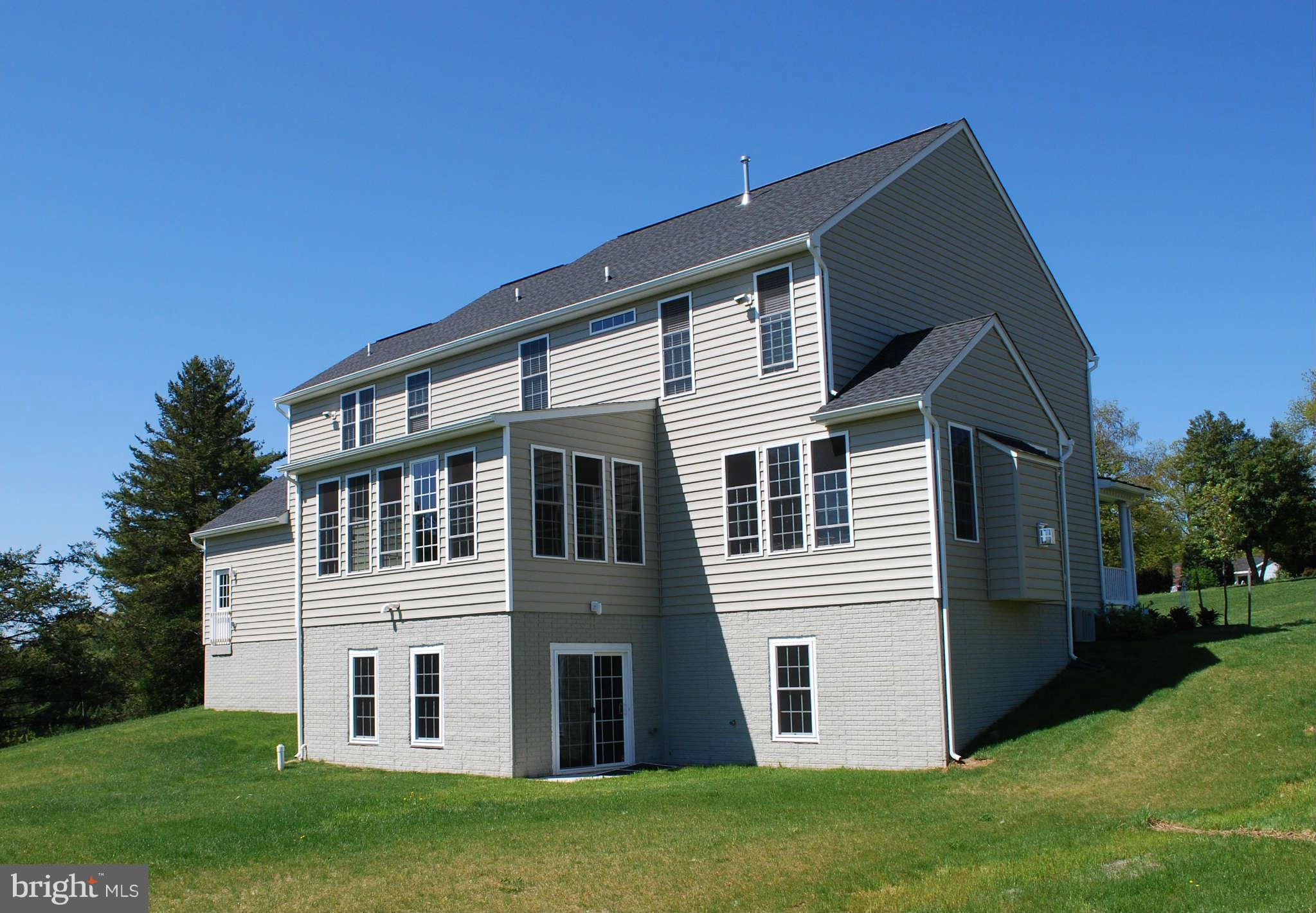7209 Talbot Run Road Mount Airy, MD 21771 - Photo 2 of 25 a view of a house with a yard