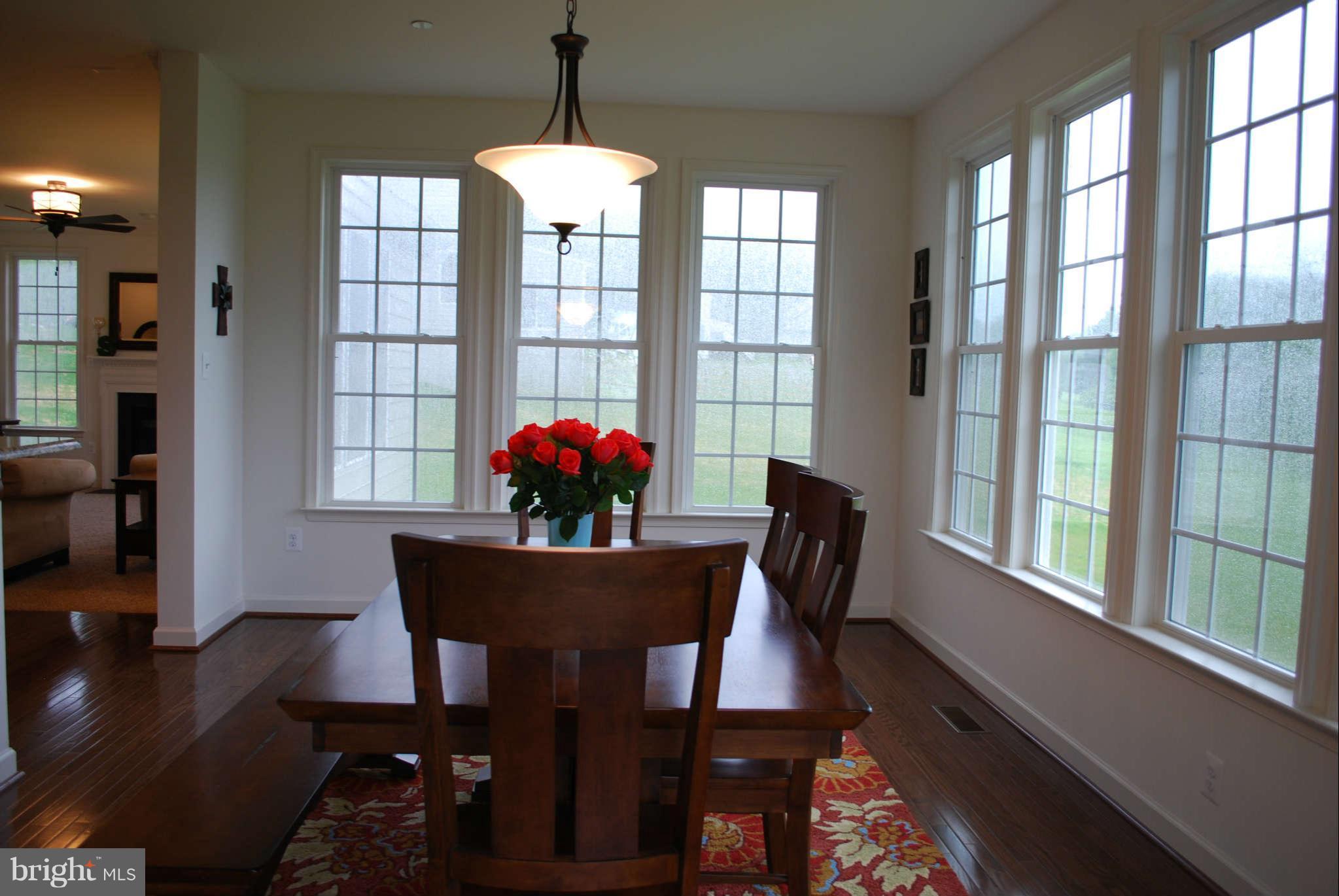7209 Talbot Run Road Mount Airy, MD 21771 - Photo 12 of 25 a view of a dining room with furniture and a window
