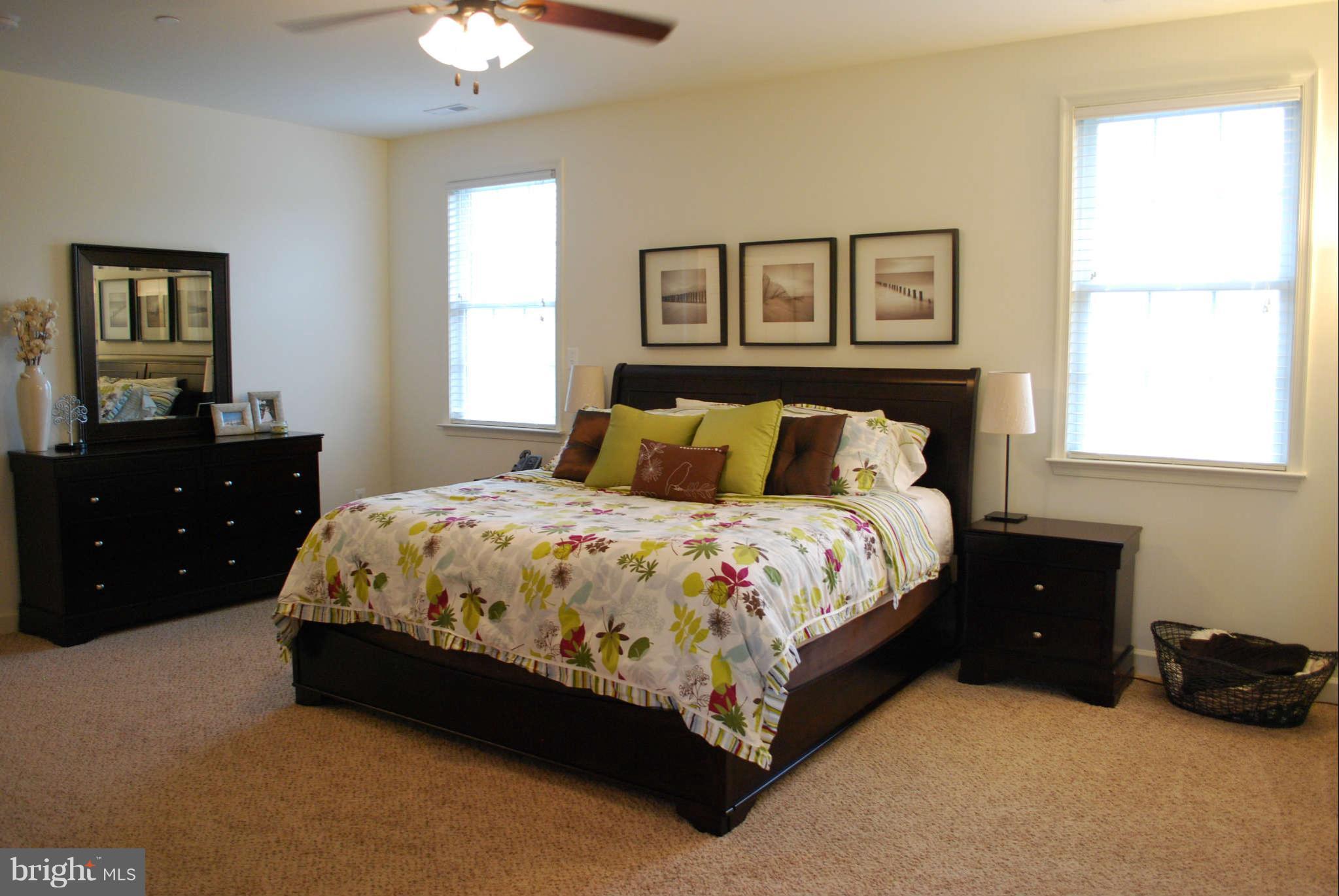 7209 Talbot Run Road Mount Airy, MD 21771 - Photo 14 of 25 a bedroom with a bed and a dresser
