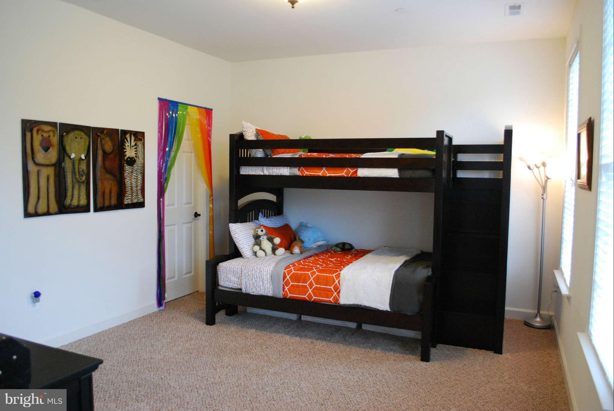 7209 Talbot Run Road Mount Airy, MD 21771 - Photo 20 of 25 a bedroom with a bed and wooden floor