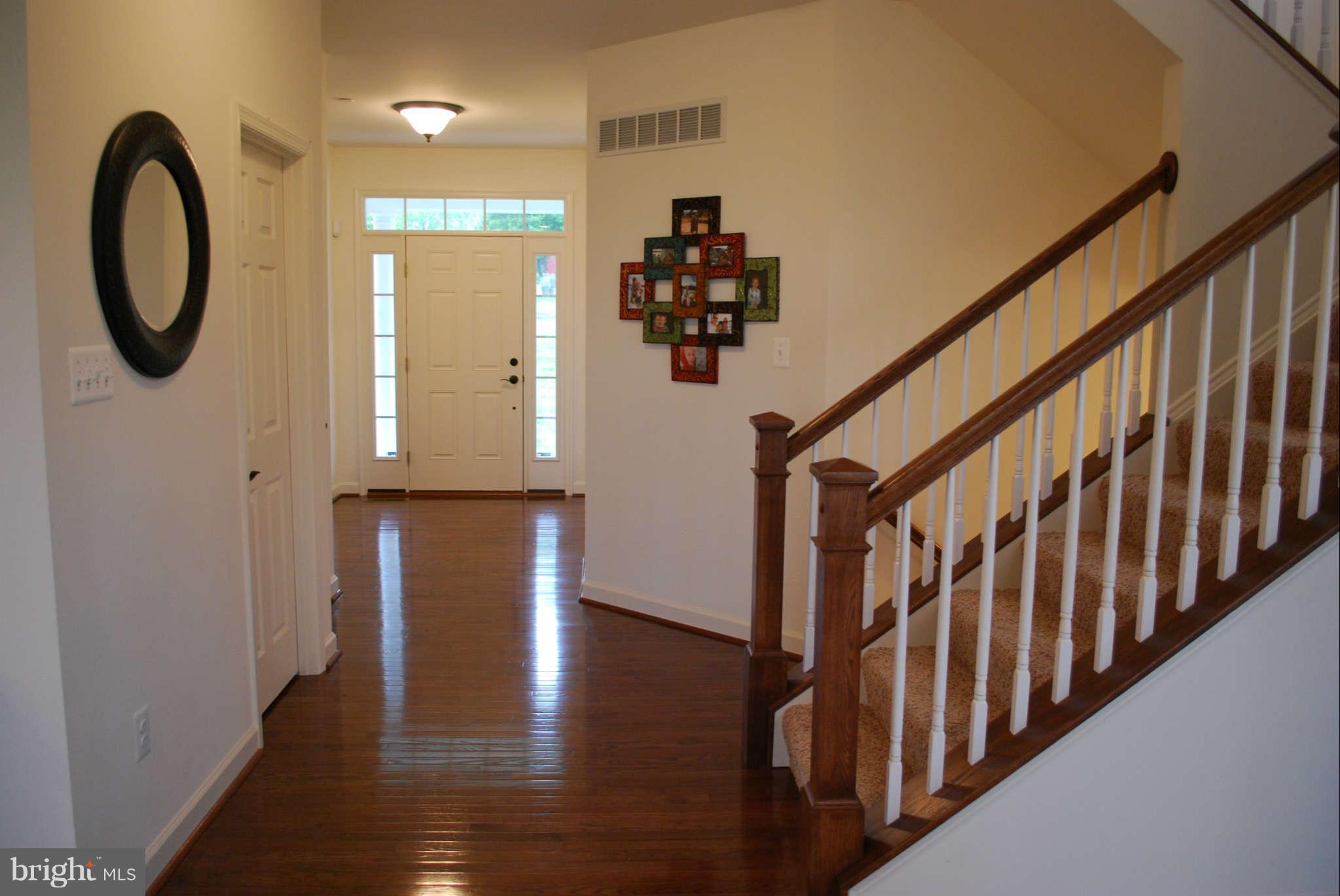 7209 Talbot Run Road Mount Airy, MD 21771 - Photo 3 of 25 a view of entryway and hall with wooden floor