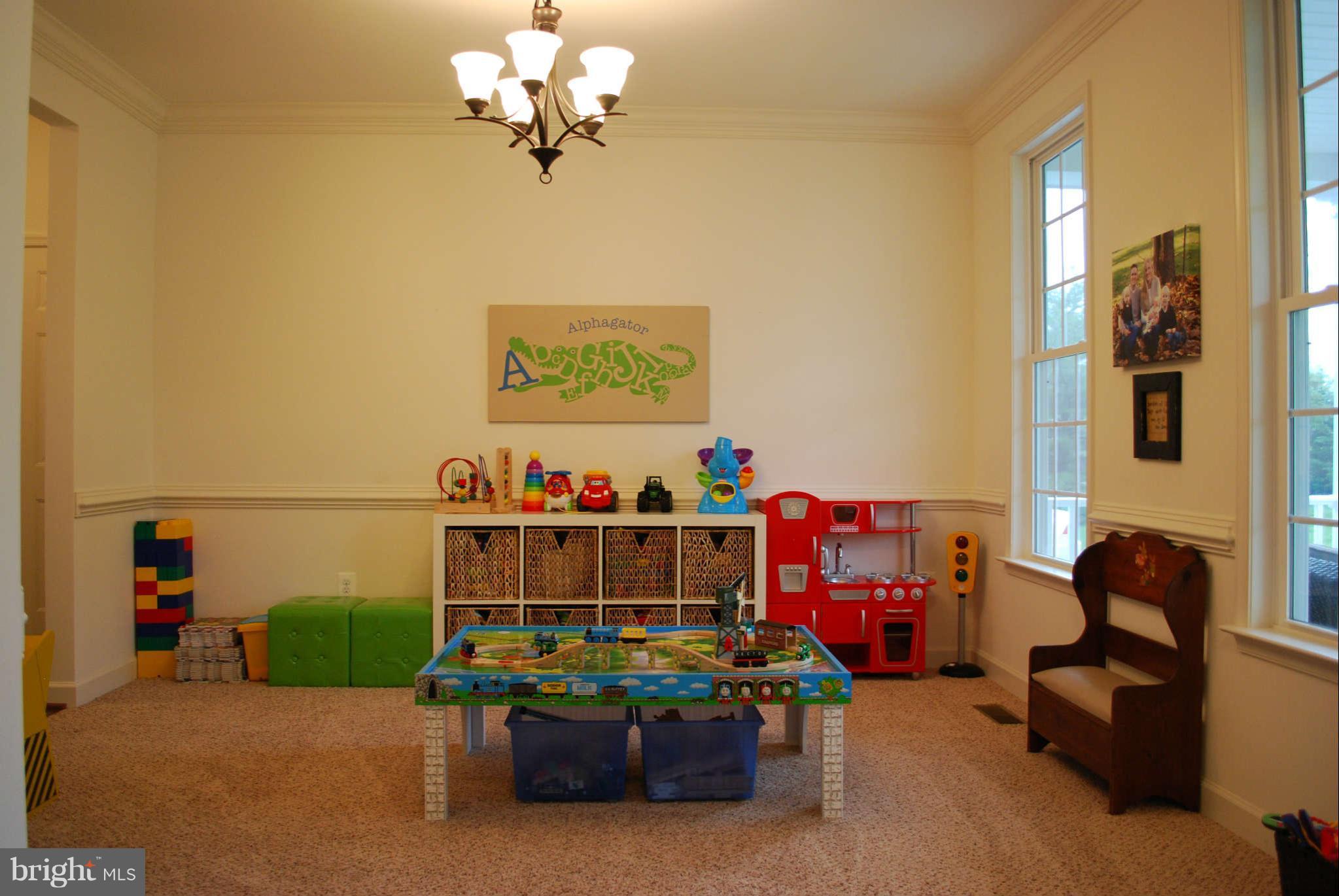 7209 Talbot Run Road Mount Airy, MD 21771 - Photo 5 of 25 a view of a bedroom with furniture and toys