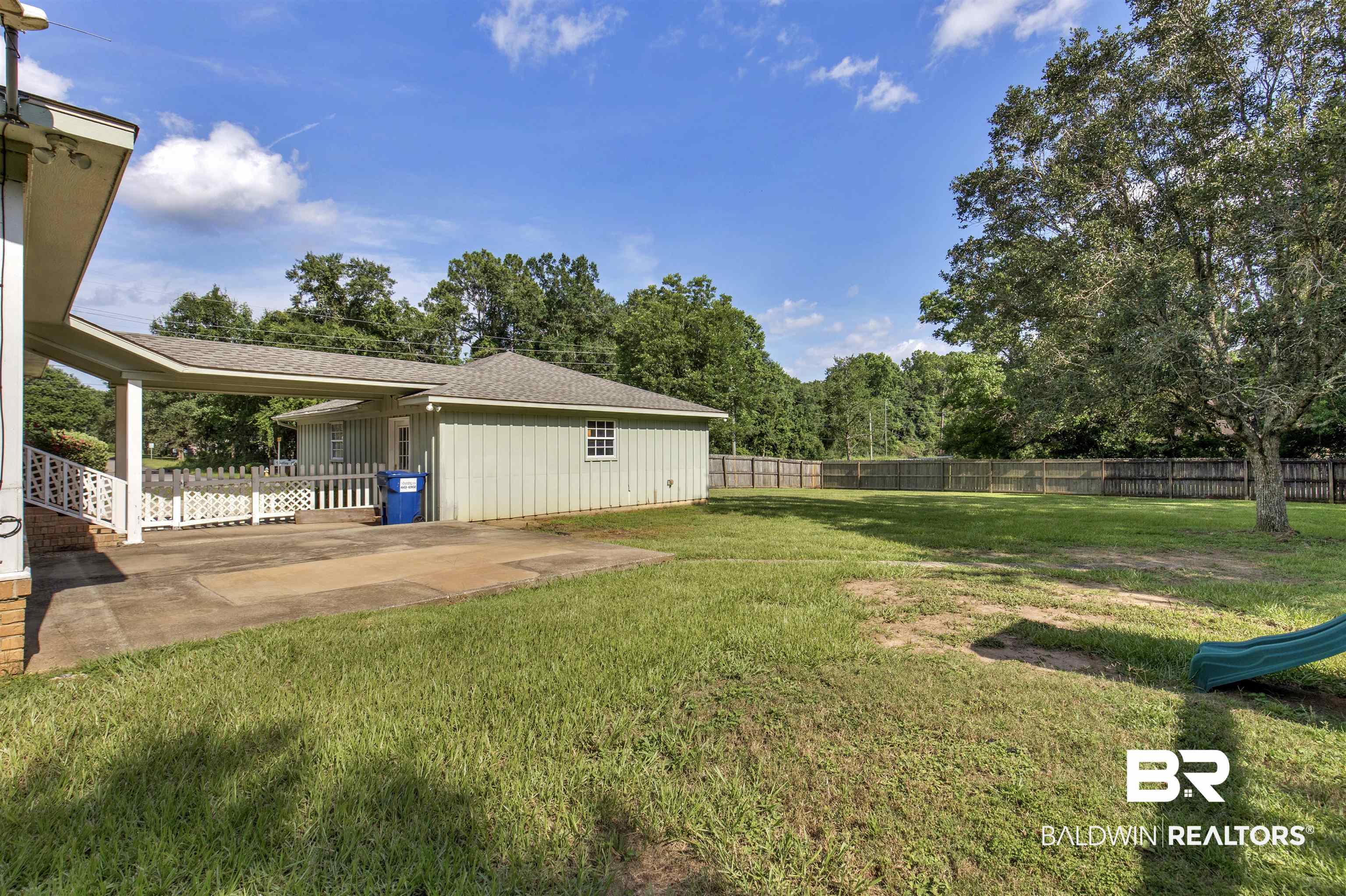 9215 Shiloh Drive Mobile, AL 36695 - Photo 29 of 32 Fenced backyard with a patio area