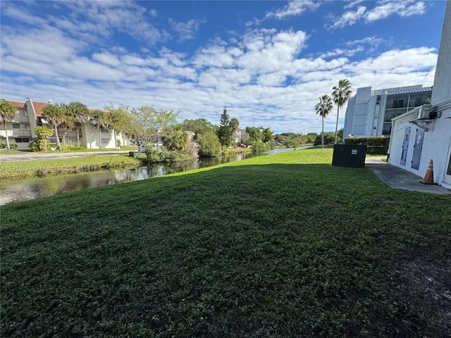 front view of building with a yard