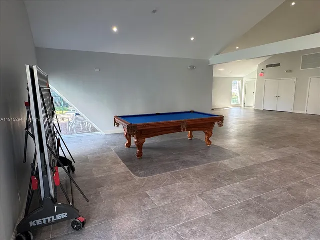 a view of a utility room with cabinets