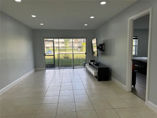a room with a large window and a sink