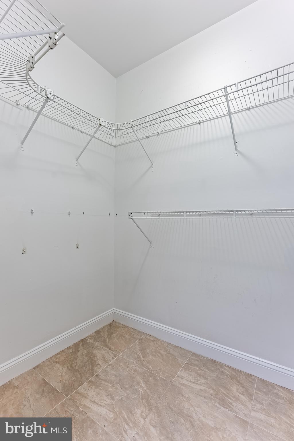 1840 D Street Northeast, Unit 1 Washington, DC 20002 - Photo 19 of 40 a view of a room with racks on the wall